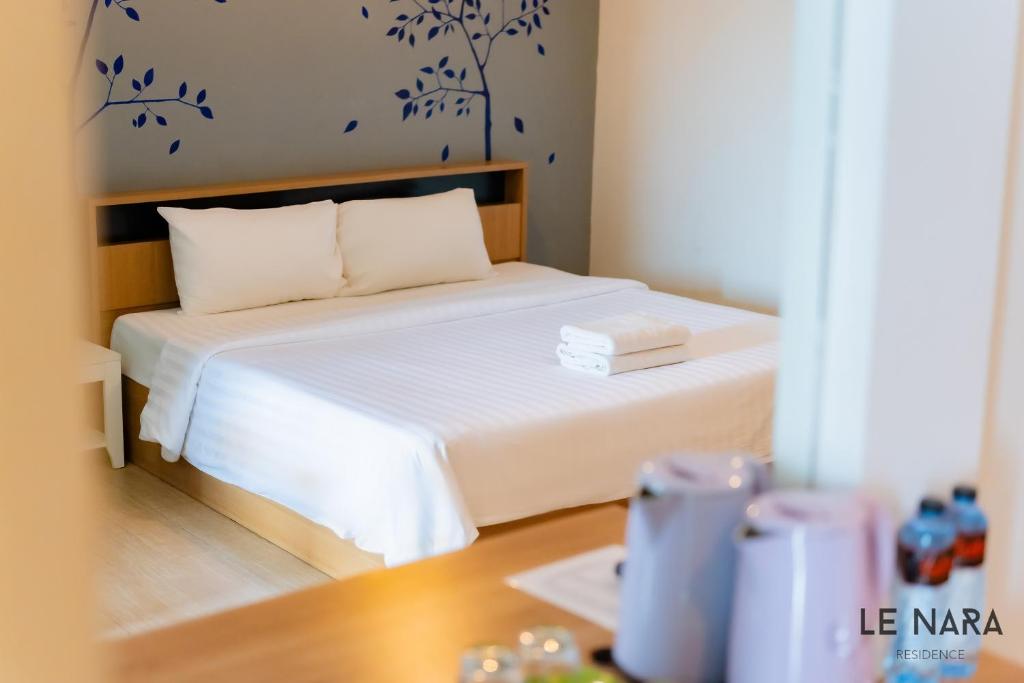 Postel nebo postele na pokoji v ubytování Le Nara Residence