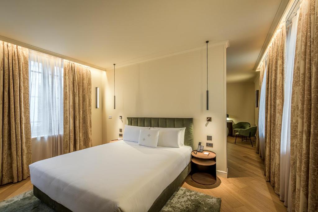Postel nebo postele na pokoji v ubytování Palazzo Montebello