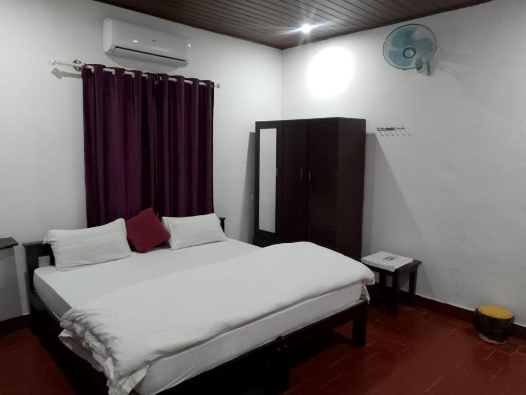 Postel nebo postele na pokoji v ubytování Humble Nest Coorg