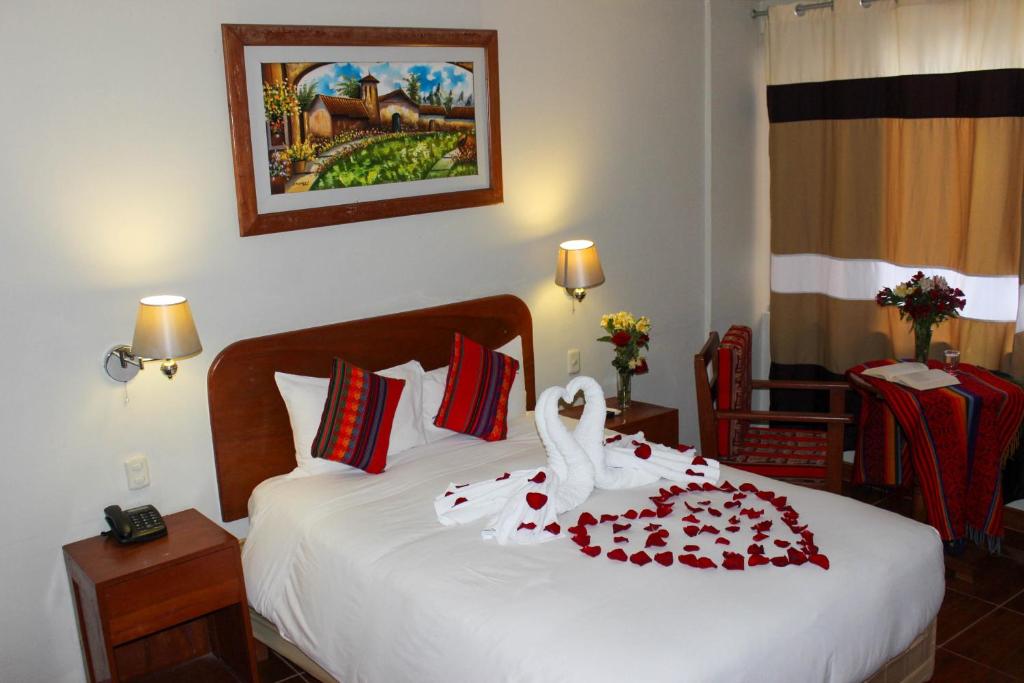 Postel nebo postele na pokoji v ubytování Hotel Wiracocha Machupicchu