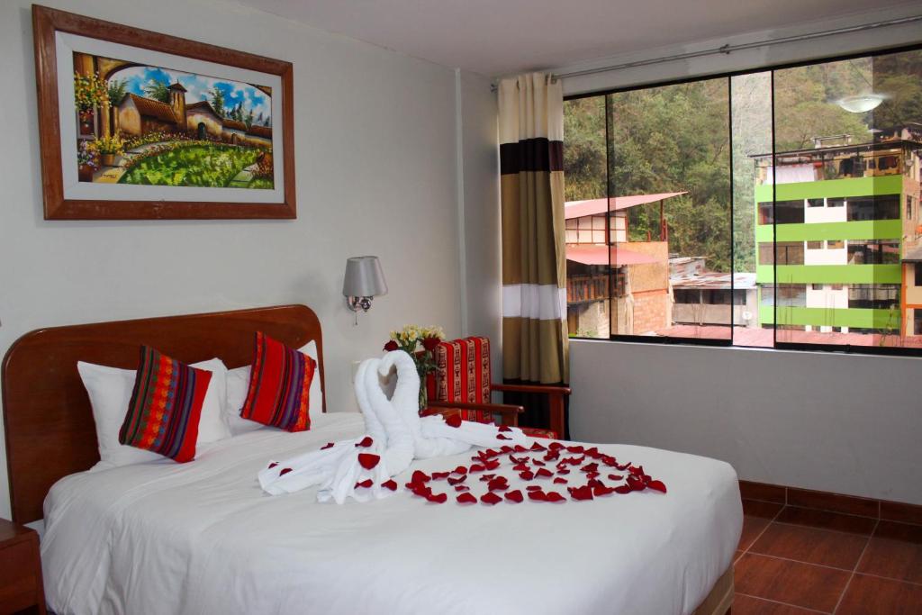 Postel nebo postele na pokoji v ubytování Hotel Wiracocha Machupicchu