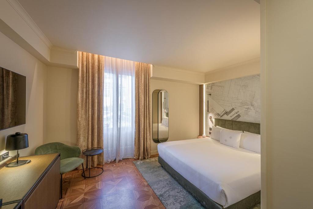 Postel nebo postele na pokoji v ubytování Palazzo Montebello