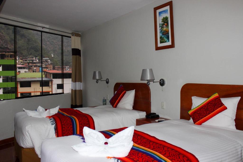 Postel nebo postele na pokoji v ubytování Hotel Wiracocha Machupicchu
