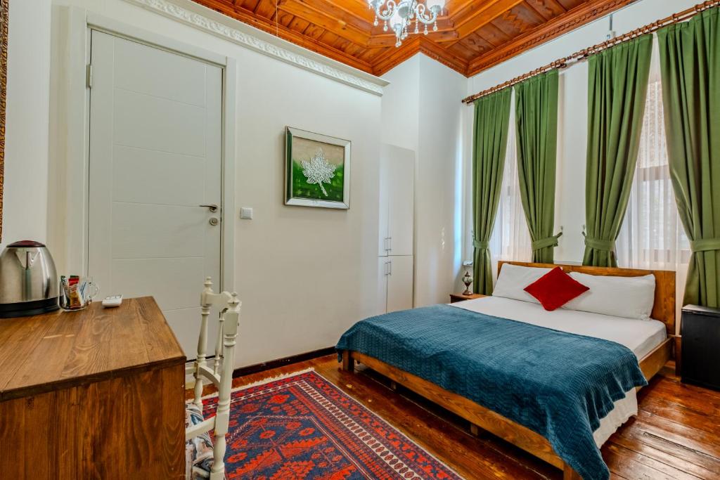 Postel nebo postele na pokoji v ubytování Nevalist Hotel