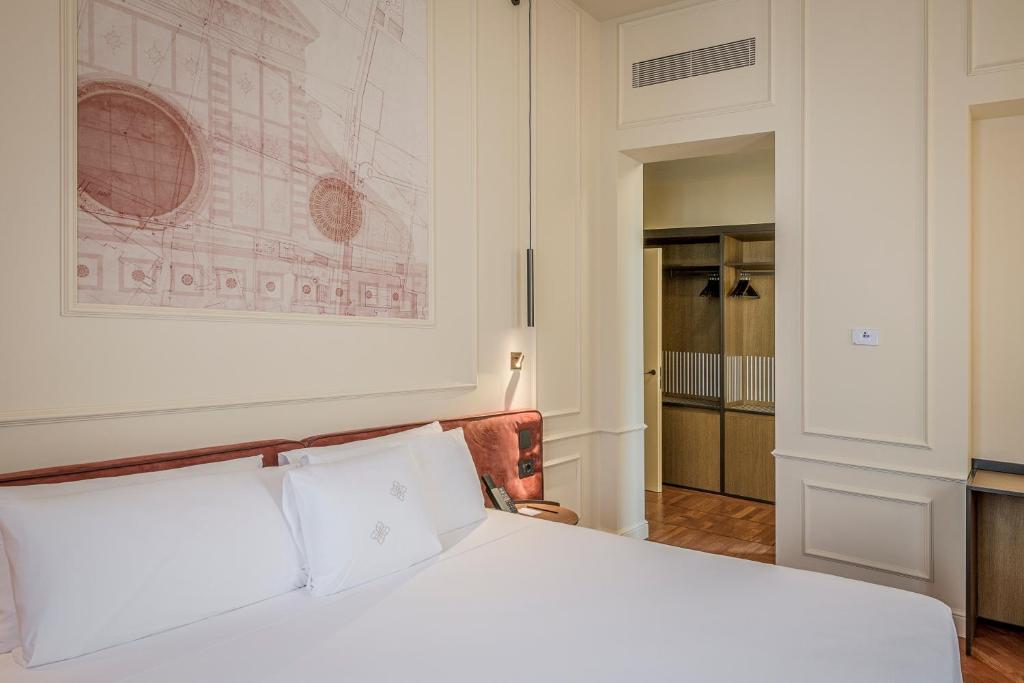 Postel nebo postele na pokoji v ubytování Palazzo Montebello