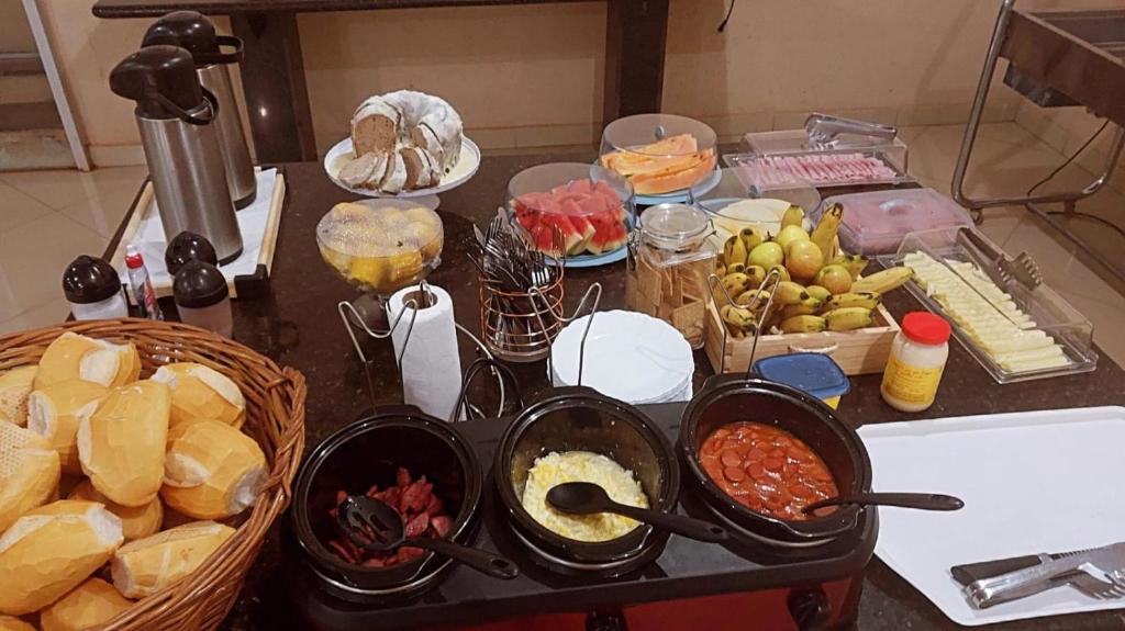 a table with many different types of food on it at GRAN HOTEL in Três Lagoas