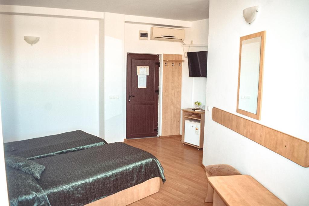 Postel nebo postele na pokoji v ubytování Pensiunea Belvedere