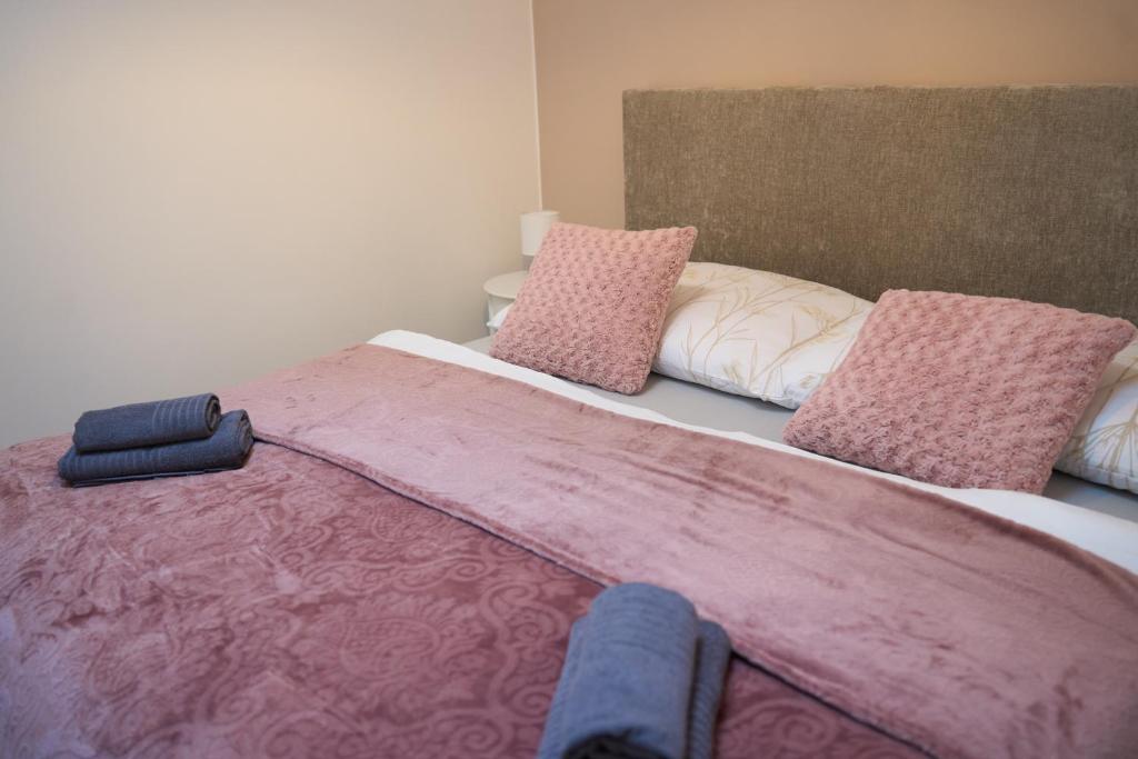 Postel nebo postele na pokoji v ubytování Apartmány U Kostela