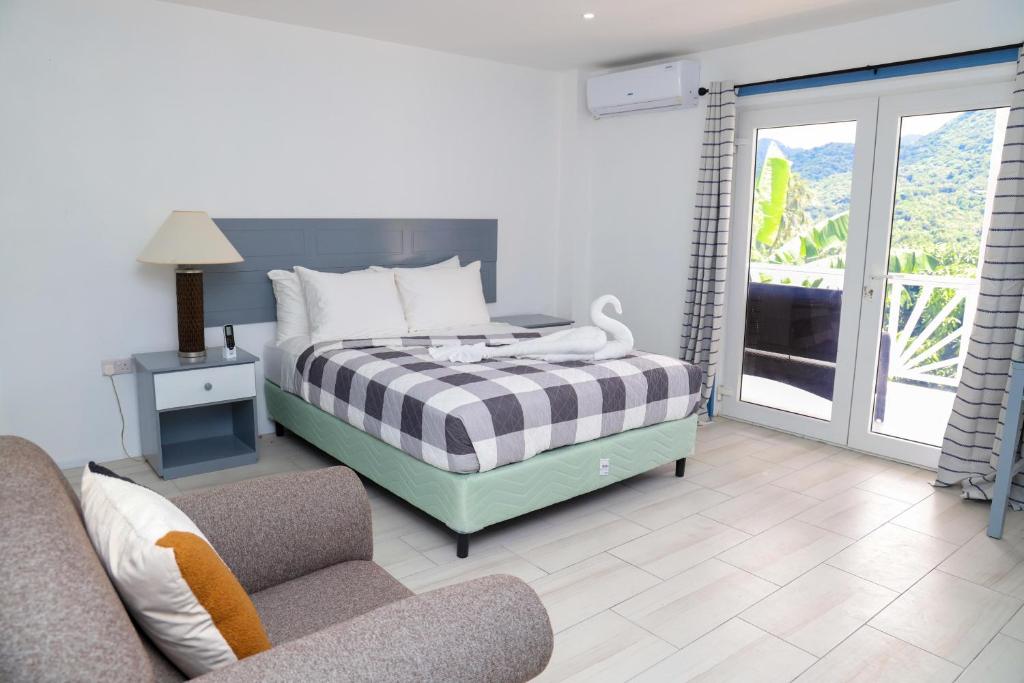 Postel nebo postele na pokoji v ubytování Sugarmon Villas