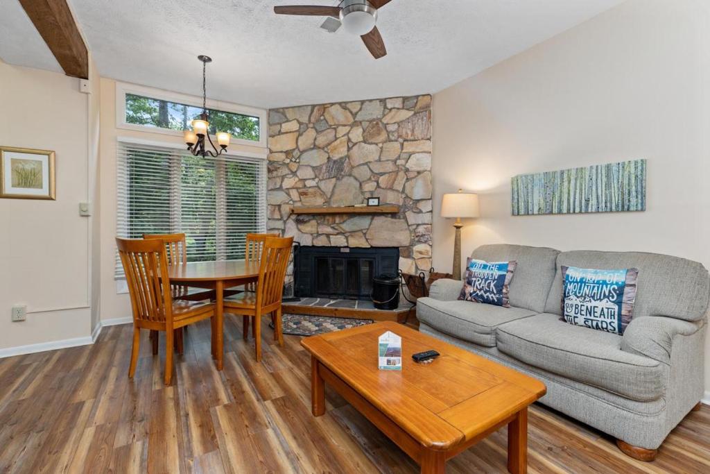 a living room with a couch and a table at Laurelwood 80 with Wintergreen Advantage in Wintergreen