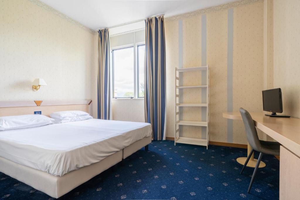 Postel nebo postele na pokoji v ubytování Hotel Torre Di Pratolungo