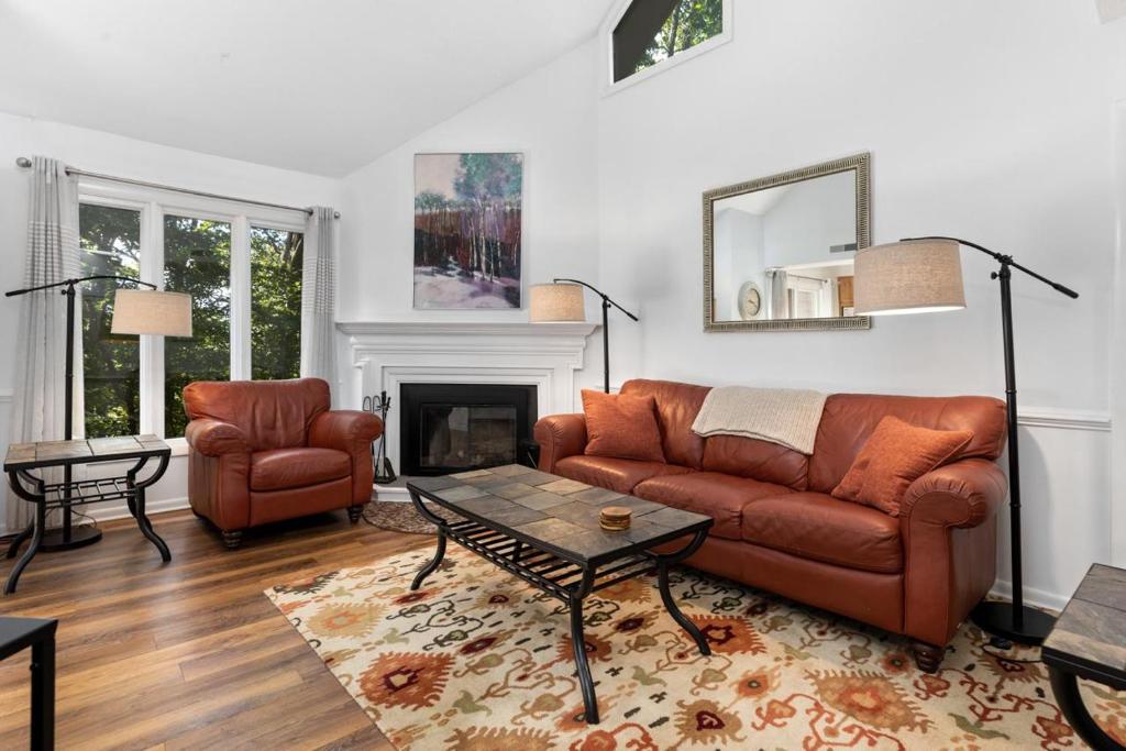 a living room with a couch and a table at Laurelwood 25 with Wintergreen Advantage in Wintergreen