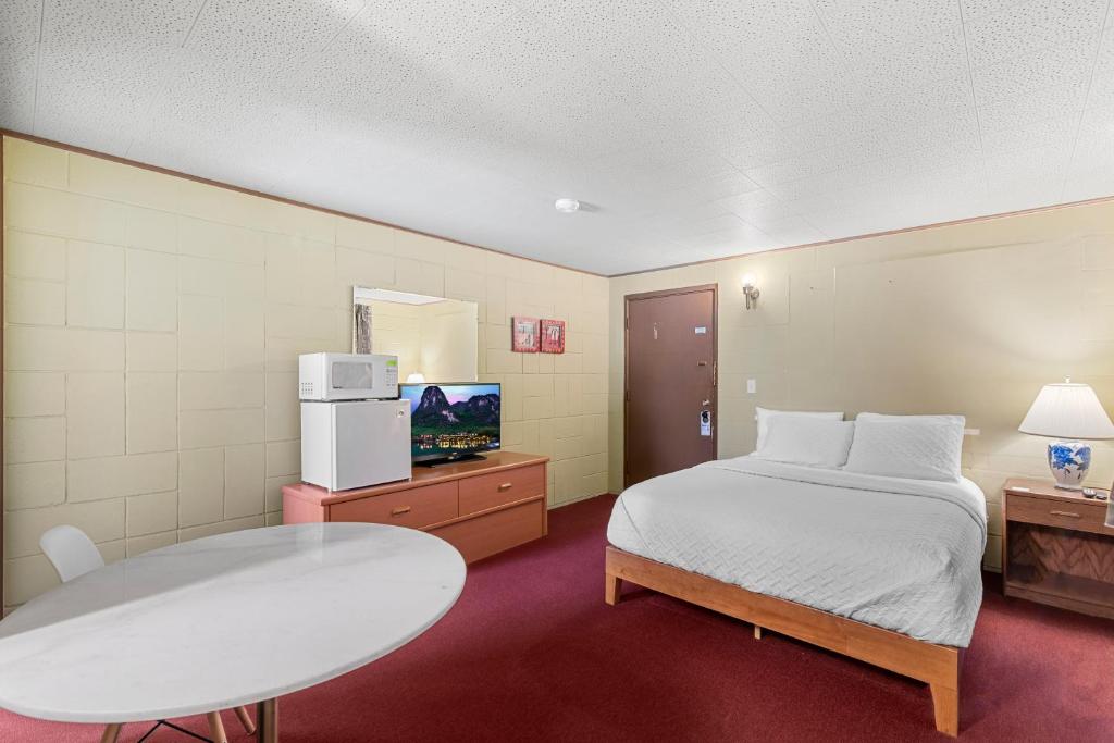 Postel nebo postele na pokoji v ubytování Cashmere Inn