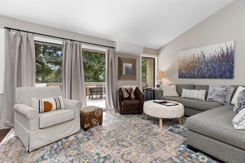 a living room with a couch and a chair at White Oak 51 with Wintergreen Advantage in Wintergreen