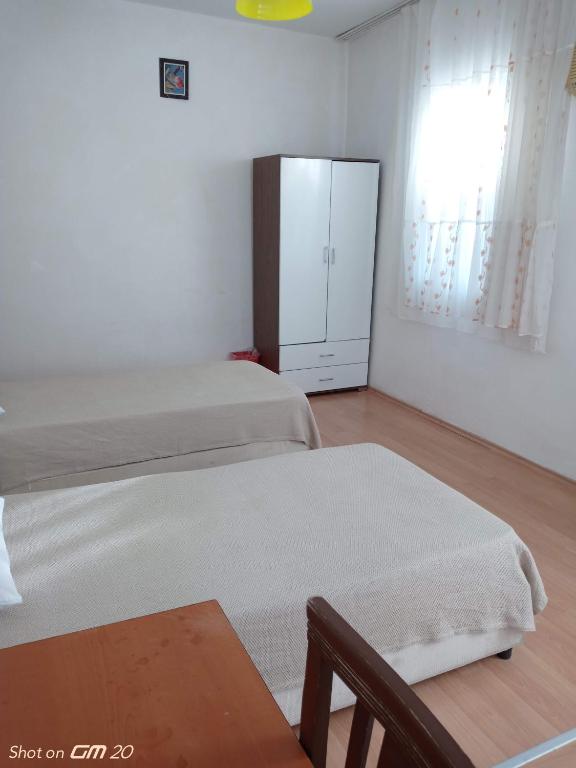 Postel nebo postele na pokoji v ubytování HZD Apartments Hostel