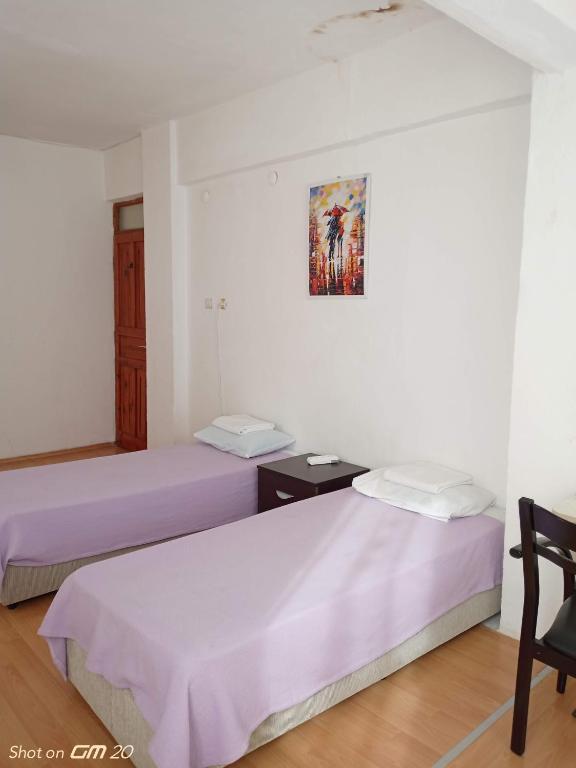Postel nebo postele na pokoji v ubytování HZD Apartments Hostel