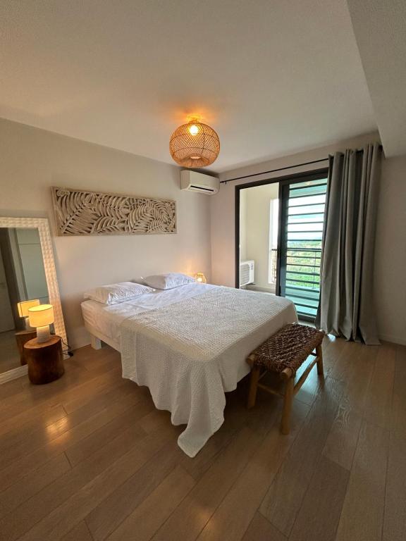 Voodi või voodid majutusasutuse Cosy Vaikea Lodge, Pamatai road toas