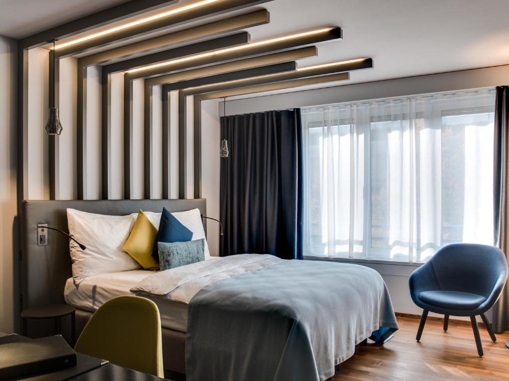 Postel nebo postele na pokoji v ubytování Park Hotel Zug