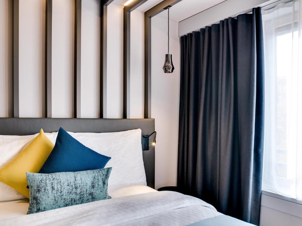 Postel nebo postele na pokoji v ubytování Park Hotel Zug