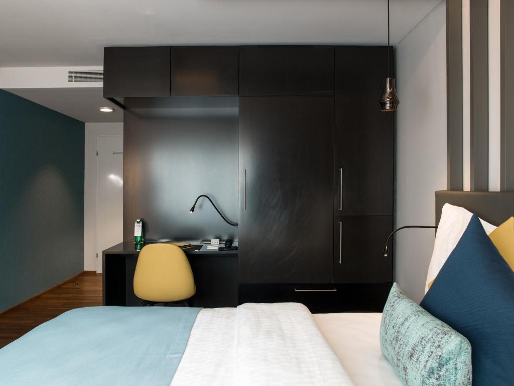 Postel nebo postele na pokoji v ubytování Park Hotel Zug