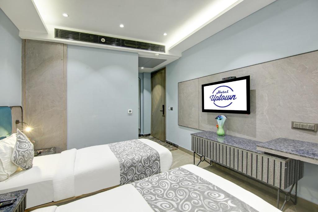 Postel nebo postele na pokoji v ubytování Hotel Uptown 1Km Connaught Place