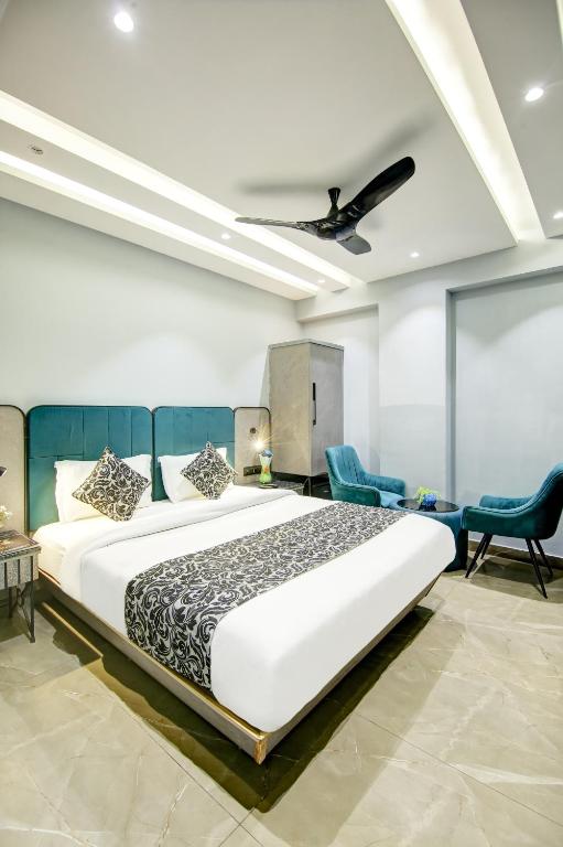 Postel nebo postele na pokoji v ubytování Hotel Uptown 1Km Connaught Place