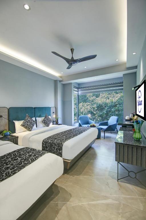 Postel nebo postele na pokoji v ubytování Hotel Uptown 1Km Connaught Place