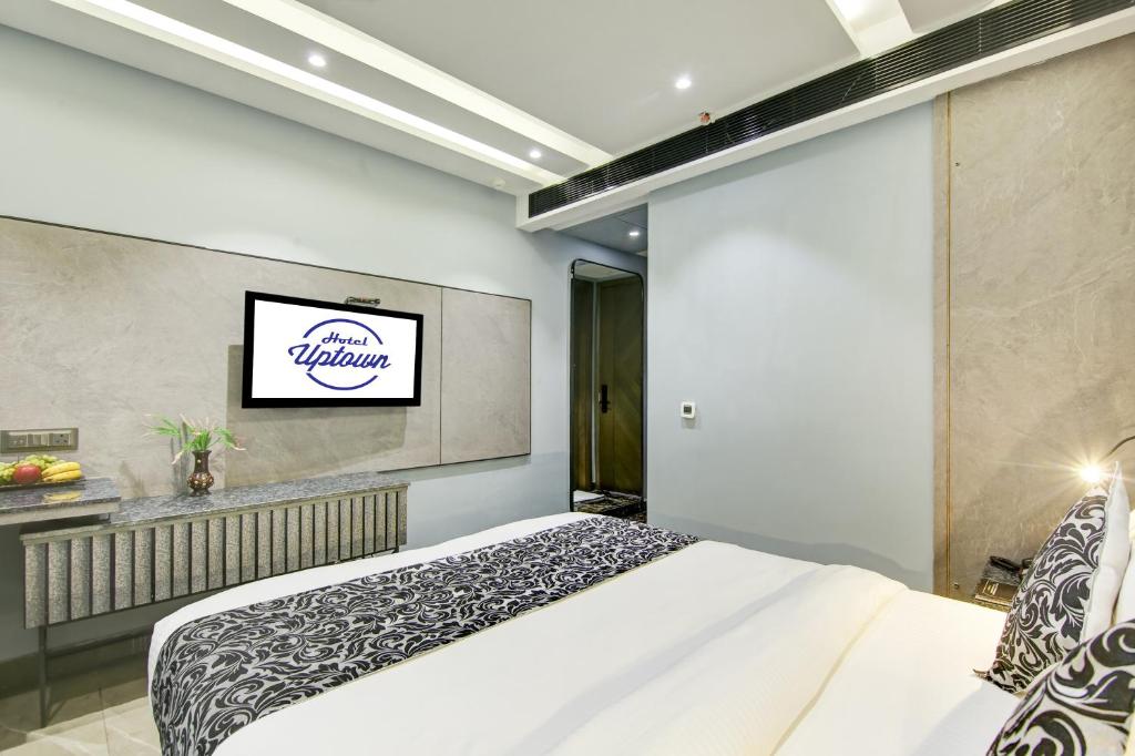 Postel nebo postele na pokoji v ubytování Hotel Uptown 1Km Connaught Place