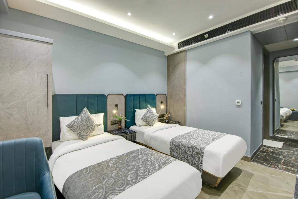 Postel nebo postele na pokoji v ubytování Hotel Uptown 1Km Connaught Place