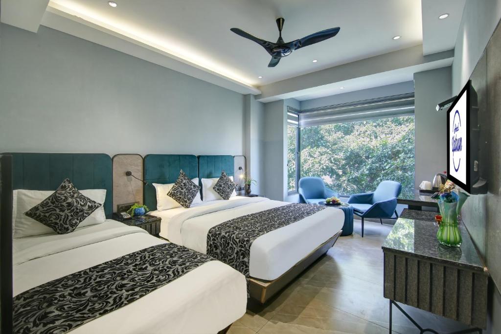 Postel nebo postele na pokoji v ubytování Hotel Uptown 1Km Connaught Place