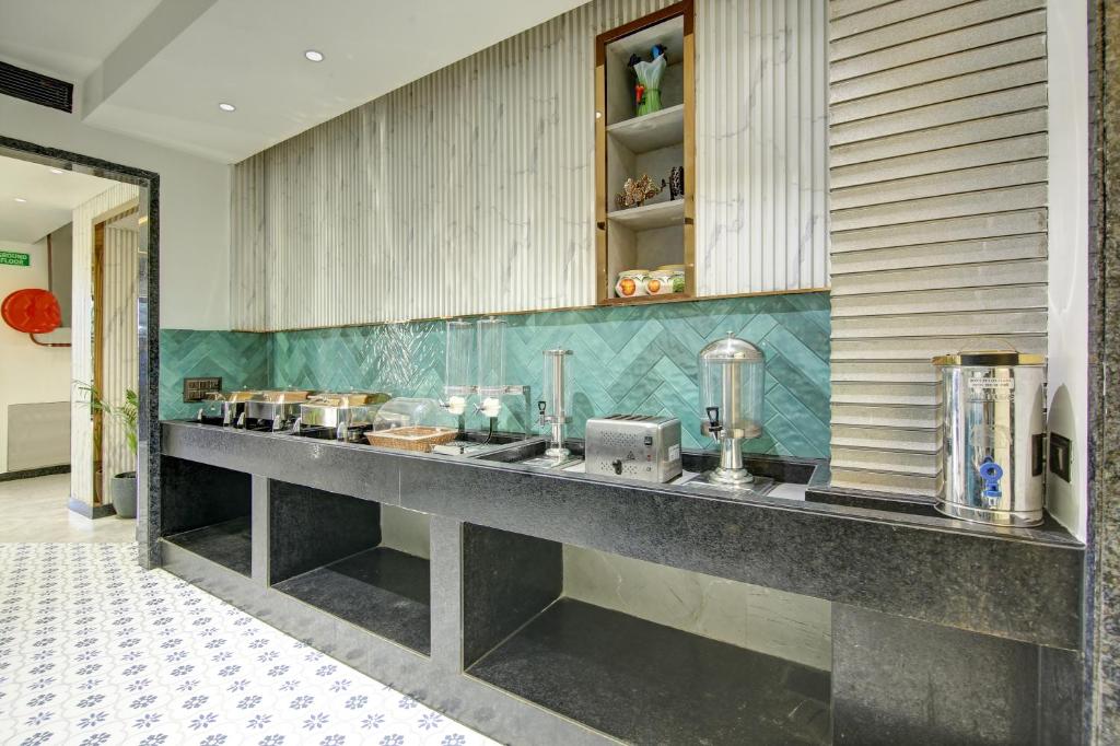 Kuchyň nebo kuchyňský kout v ubytování Hotel Uptown 1Km Connaught Place