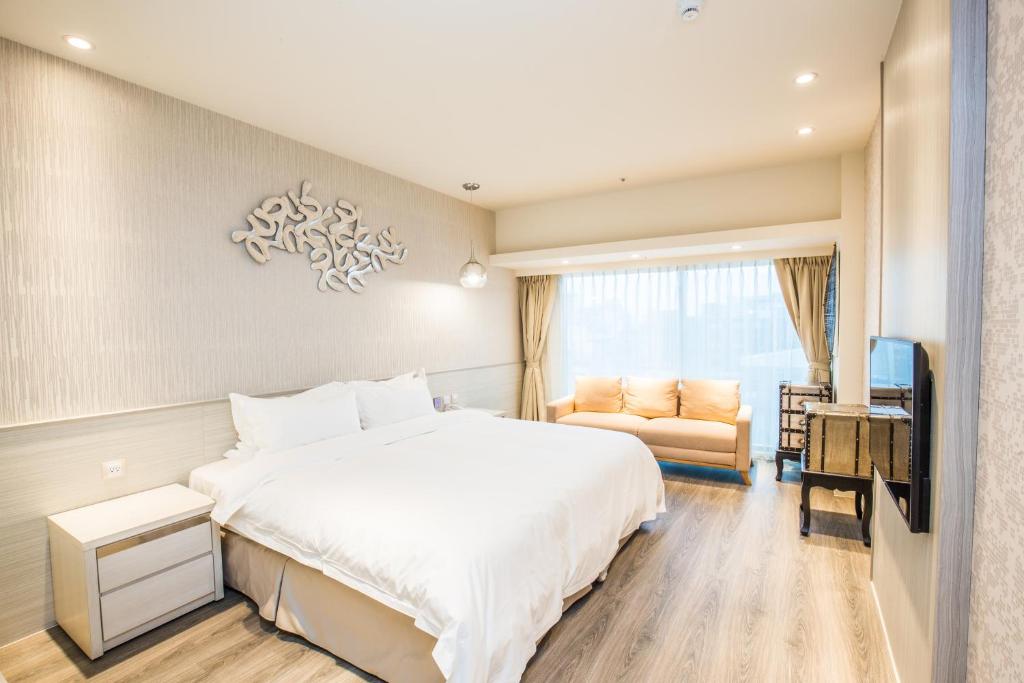 Postel nebo postele na pokoji v ubytování Walker Hotel. Ximen