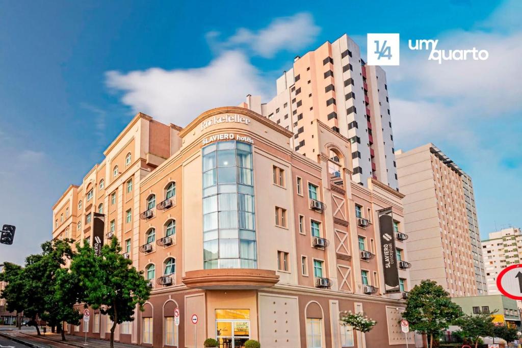 a large building in front of a tall building at Manhattan Floor in Curitiba