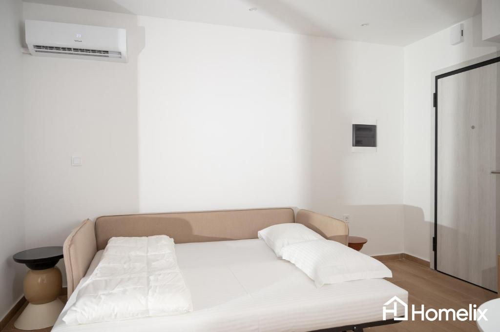 Postel nebo postele na pokoji v ubytování AMAYA - Sea View Suites