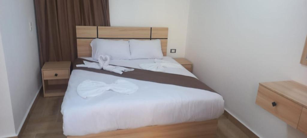 Postel nebo postele na pokoji v ubytování Malak Guest House