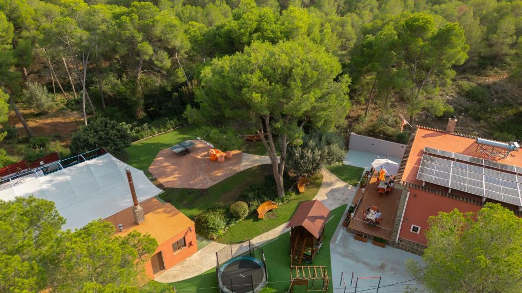 an overhead view of a large house with a tree at Eco-hotel Aire de Monte in Náquera
