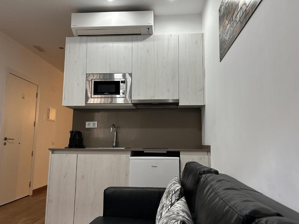 Kuchyň nebo kuchyňský kout v ubytování Apartahotel Baldiri
