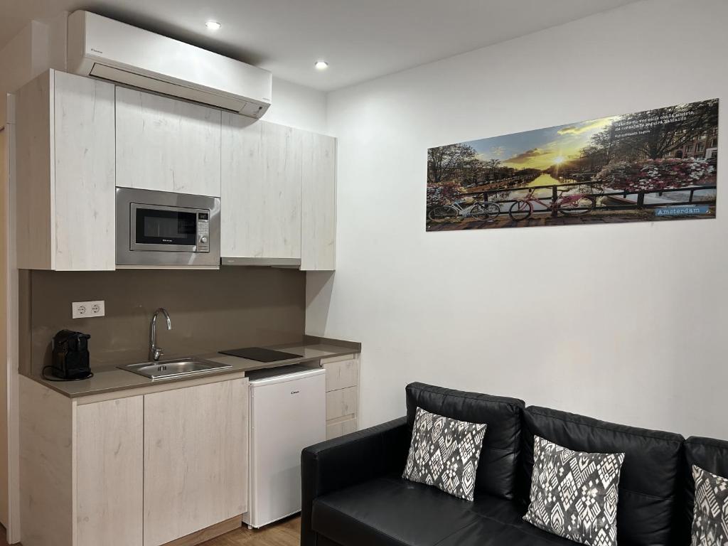 Kuchyň nebo kuchyňský kout v ubytování Apartahotel Baldiri