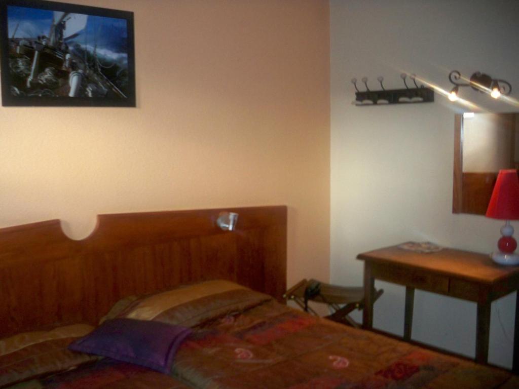 Postel nebo postele na pokoji v ubytování Ad Cyber-Hôtel