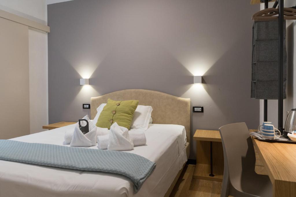 Postel nebo postele na pokoji v ubytování Hotel Doria