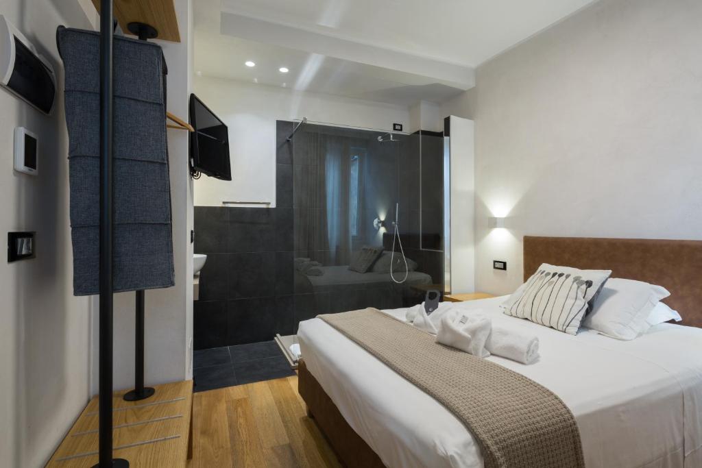 Postel nebo postele na pokoji v ubytování Hotel Doria