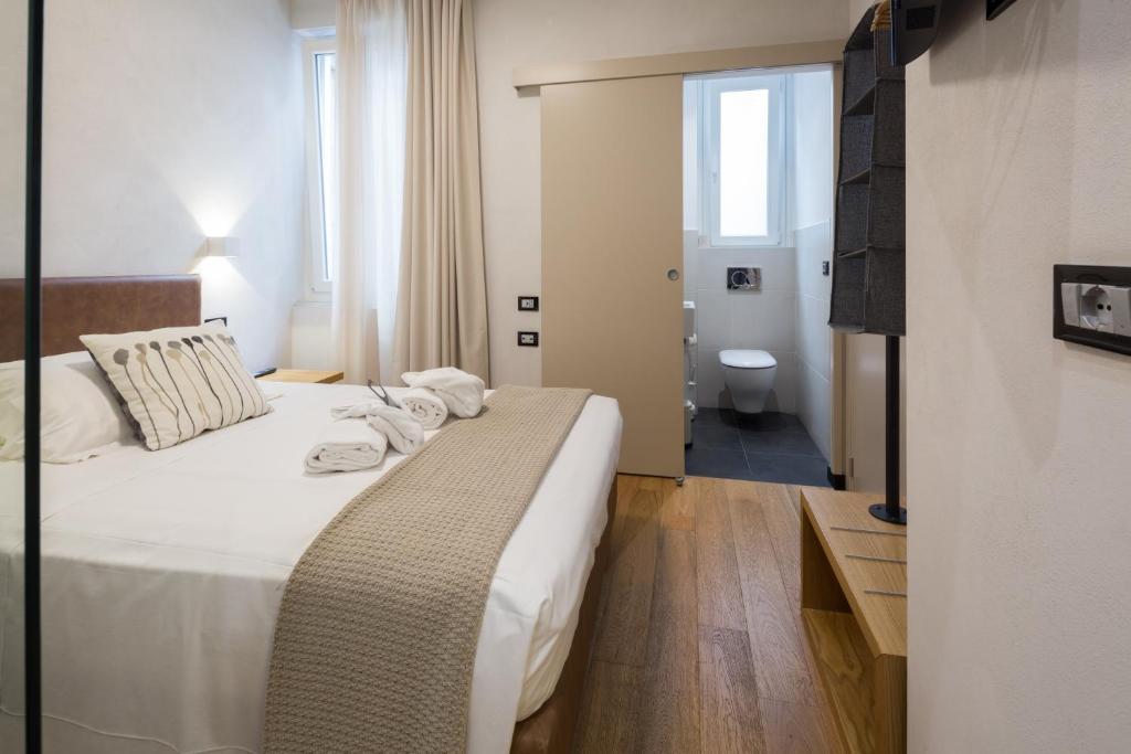Postel nebo postele na pokoji v ubytování Hotel Doria
