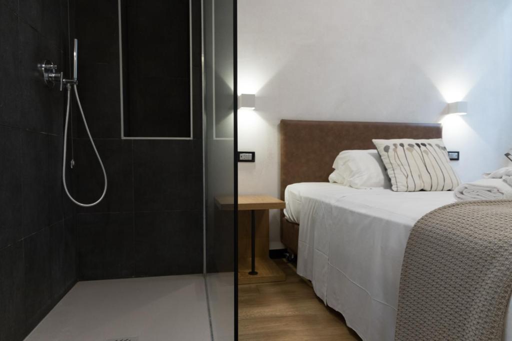 Postel nebo postele na pokoji v ubytování Hotel Doria