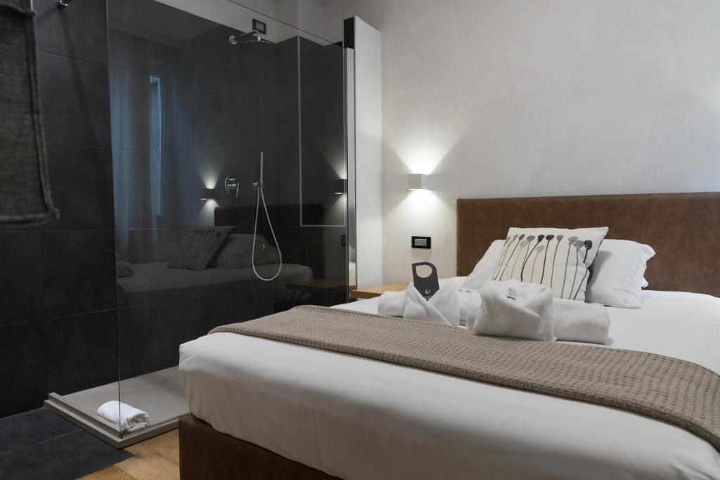 Postel nebo postele na pokoji v ubytování Hotel Doria