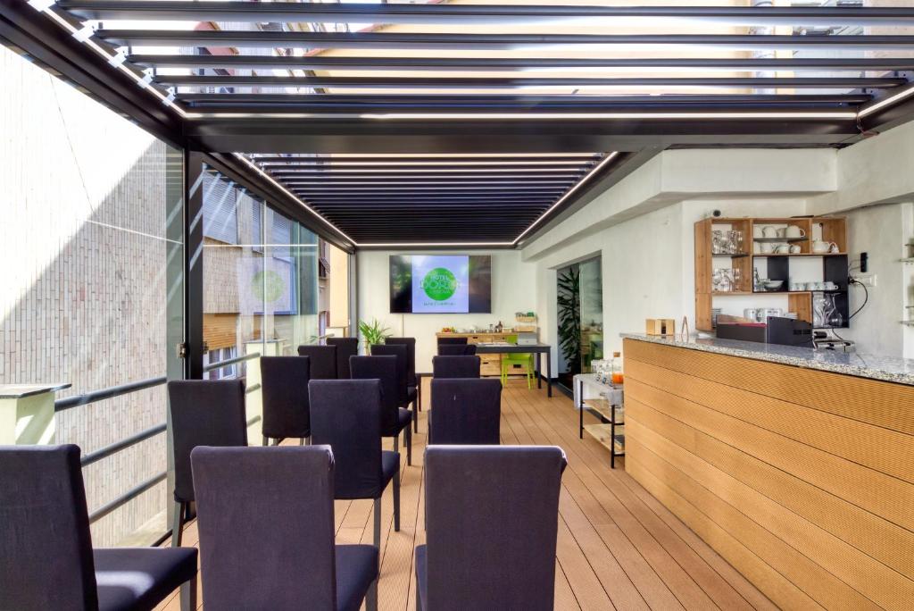 TV a/nebo společenská místnost v ubytování Hotel Doria