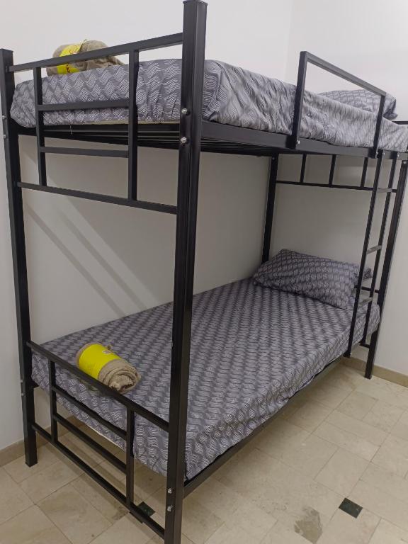 Postel nebo postele na pokoji v ubytování AL SHAMS MUSCAT MALE hostel