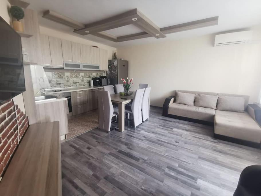 a living room with a couch and a table at Luxurious flat - Pleven center in Pleven
