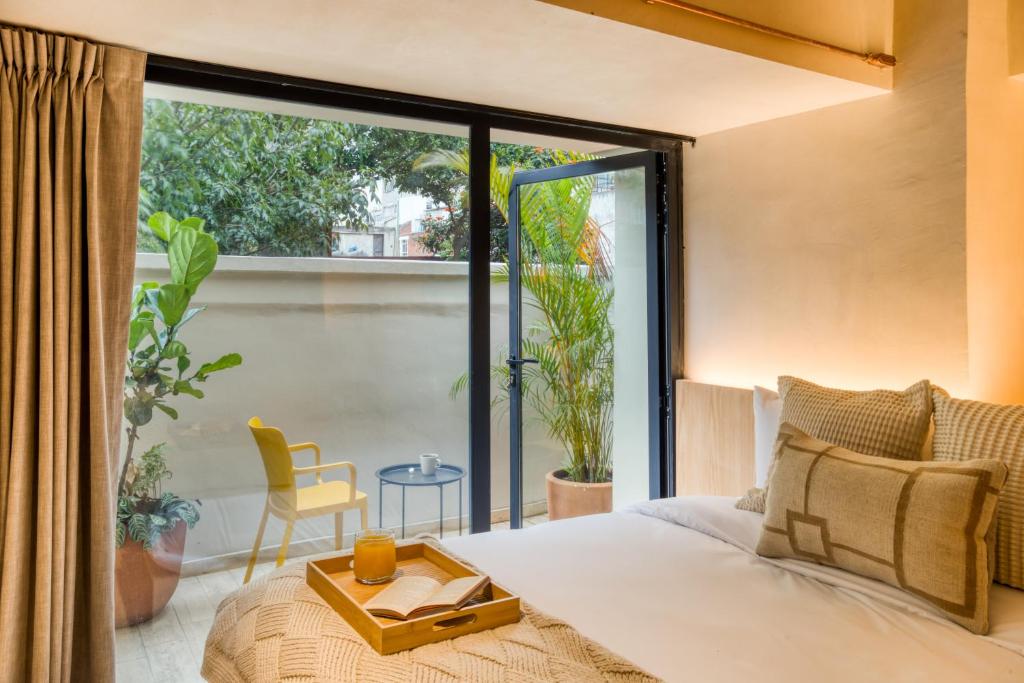 Postel nebo postele na pokoji v ubytování Caliza Roma Residences by Tasman