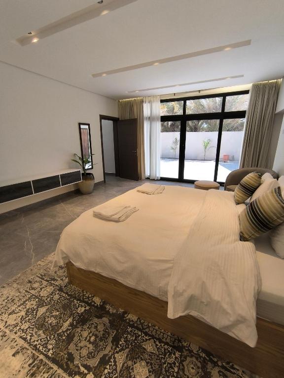 Postel nebo postele na pokoji v ubytování Bostan Al-Mostadhill Chalet