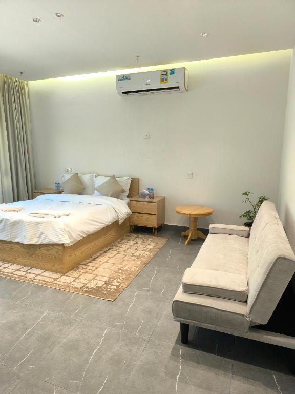 Postel nebo postele na pokoji v ubytování Bostan Al-Mostadhill Chalet